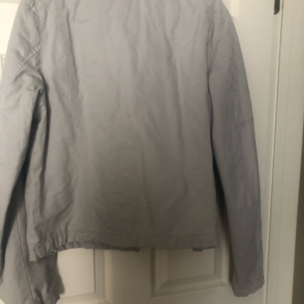 Light grey moto style jacket.